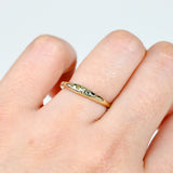 Top profile of 9ct yellow gold Sage Ring showing the natural Australian green sapphires set across the band.