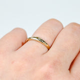 9ct yellow gold Sage Ring worn on hand showing earthy, grounded green sapphire colour.