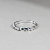 Front view of 9ct white gold ring showcasing round brilliant cut natural Australian teal sapphires, available at York Jewellers Penrith.