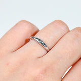 9ct white gold Sage Ring worn on hand showing shifting blue-green teal sapphire colour.