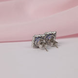 Back profile of 18ct white gold fancy double halo stud earrings showing sapphire centrepiece and layered diamond detailing, available at York Jewellers Penrith.