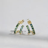 Close-up of 9ct yellow gold double hoop earrings showcasing natural Australian teal sapphires, available at York Jewellers Penrith.