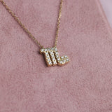 Close-up of 9ct yellow gold Scorpio pendant showcasing 21 carcelated round brilliant cut diamonds (0.13ct total) available at York Jewellers Penrith.