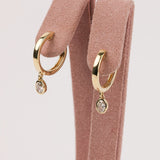 Contemporary 9ct yellow gold lab grown oval diamond huggie earrings available in York Jewellers' Western Sydney Penrith showroom.