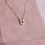 Close-up of 9ct yellow gold Taurus pendant showcasing 14 carcelated round brilliant cut diamonds (0.08ct total) available at York Jewellers Penrith.