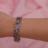 Close-up of 18ct white gold bracelet showcasing multicolour sapphires and tourmalines, available at York Jewellers Penrith.