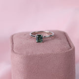 Elegant white gold sapphire ring with single centre stone showing blue-green tones, available at York Jewellers Penrith and Warriewood (Sydney).