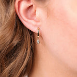 9ct yellow gold lab grown marquise diamond huggie drop earrings worn on ear showing modern movement and sparkle, available at York Jewellers Penrith and Warriewood (Sydney).