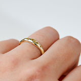 Side view of 9ct yellow gold ring showcasing round brilliant cut natural Australian yellow sapphires, available at York Jewellers Penrith.